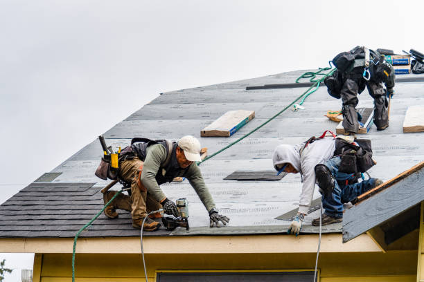 Professional Gutter Installation technician working in Arlington, MA